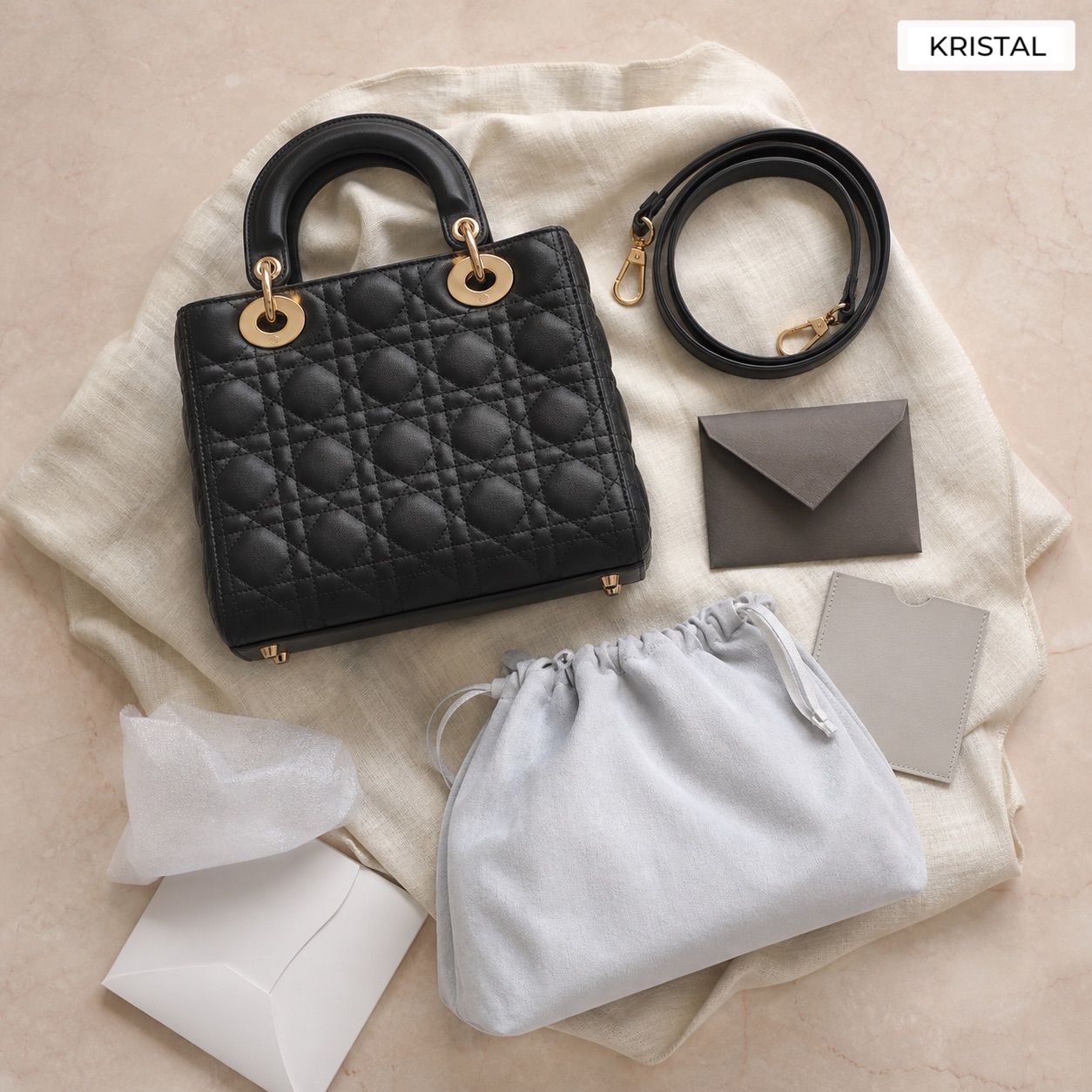 Editorial inline image showing a Dior-style bag with strap, charm, dust bag, and valuation accessories arranged for review in Malaysia
