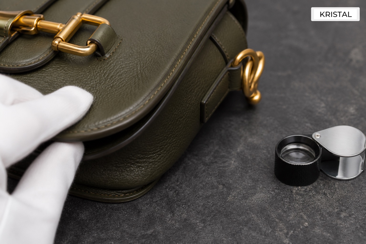 Editorial inline image showing a Gucci-style shoulder bag under close valuation inspection in Malaysia