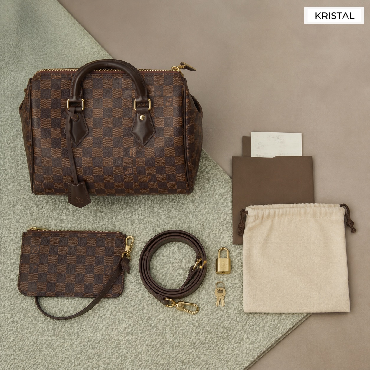 Editorial inline image showing a Louis Vuitton-style bag with pouch, strap, dust bag, and valuation accessories arranged for review in Malaysia