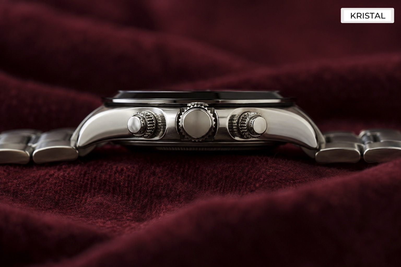 Illustrative chronograph side showing two pushers flanking a winding crown