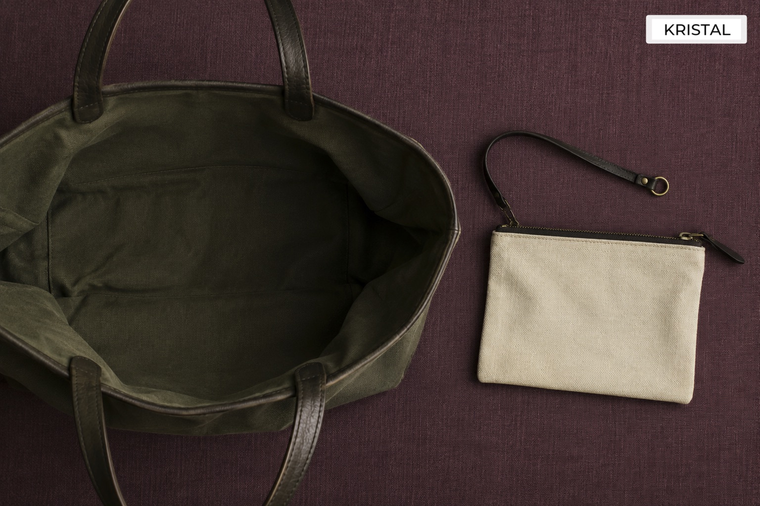Conceptual illustration of an open tote beside a separate small zipped pouch