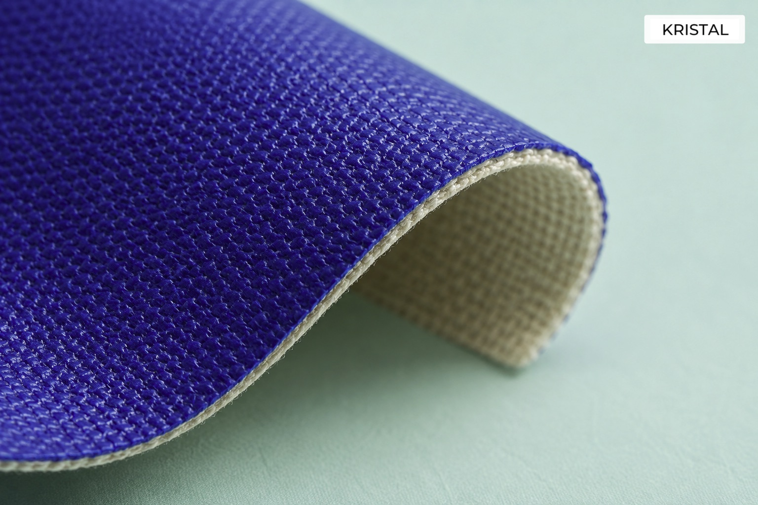 Illustrative curved coated textile sample showing a woven backing