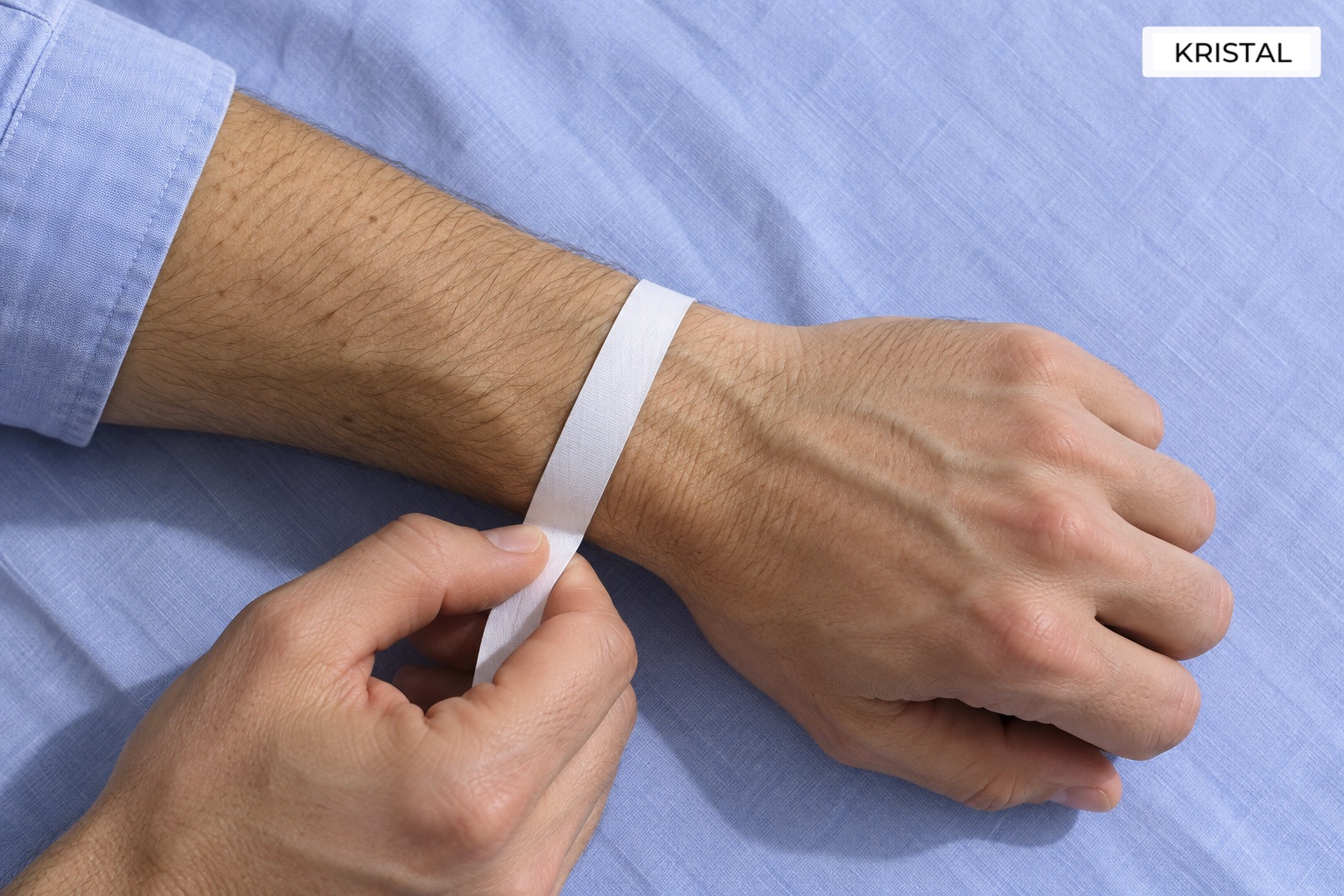 A soft tape held gently around a bare wrist to illustrate circumference measurement